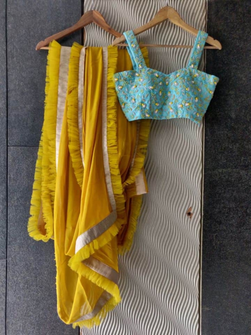 Mustard Ruffle Saree with Blue Strap Blouse Sarees