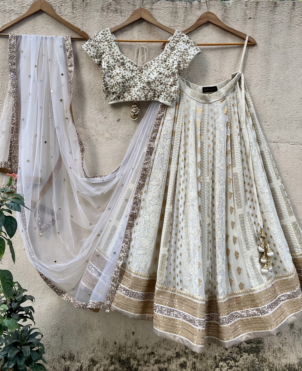 Ivory Multipaneled Lehenga Set with Embroidered Blouse - Fashion Brand & Designer Priti Sahni
